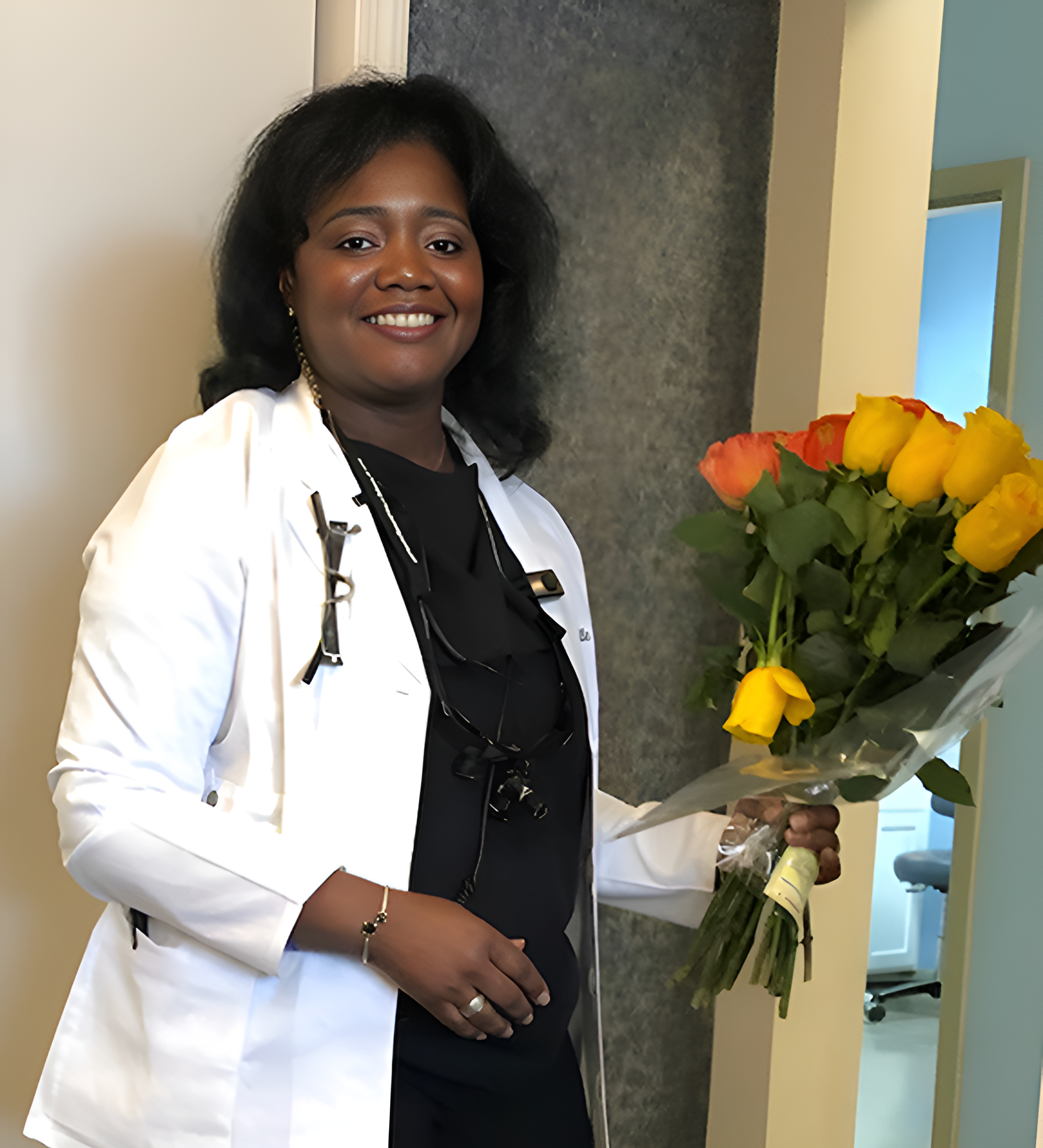 Smiling shot of Dr. White holding flowers