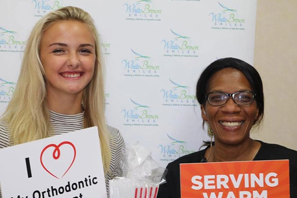 happy braces client with orthodontist in columbia sc