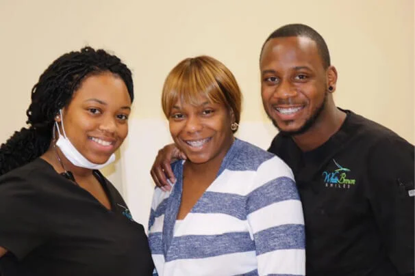 white brown smiles staff with happy client orthodontist in columbia sc